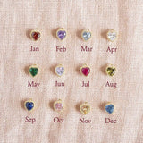 Image shows Crystal Birthstones Chart, from top left; Garnet January, Amethyst February, Aquamarine March, Crystal April, Emerald May, Light Amethyst June, Ruby July, Peridot August, Sapphire September, Rose October, Yellow Topaz November, Blue Zircon December.