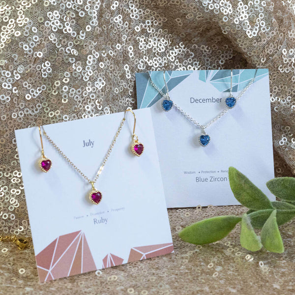 Image shows two Birthstone Hearts Jewellery Sets in July Ruby and September Sapphire birthstones