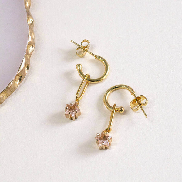 Image shows Champagne Star Dainty Hoop Earrings on a light coloured backdrop.