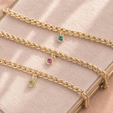 Gold plated rope chain birthstone bracelets with colourful crystal charms, bold personalised jewellery for layering.