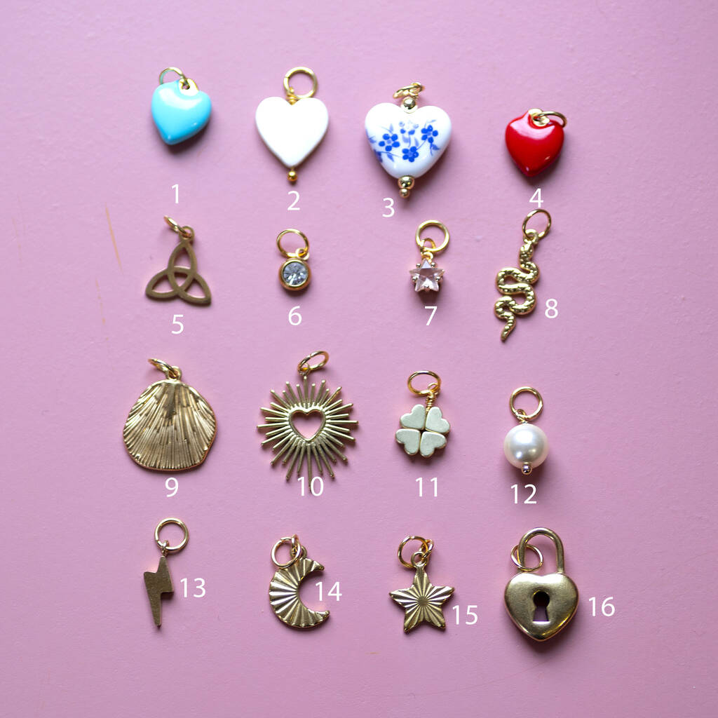 Selection of 16 gold charm options for custom bracelet including hearts, pearl, star, moon and symbolic charms