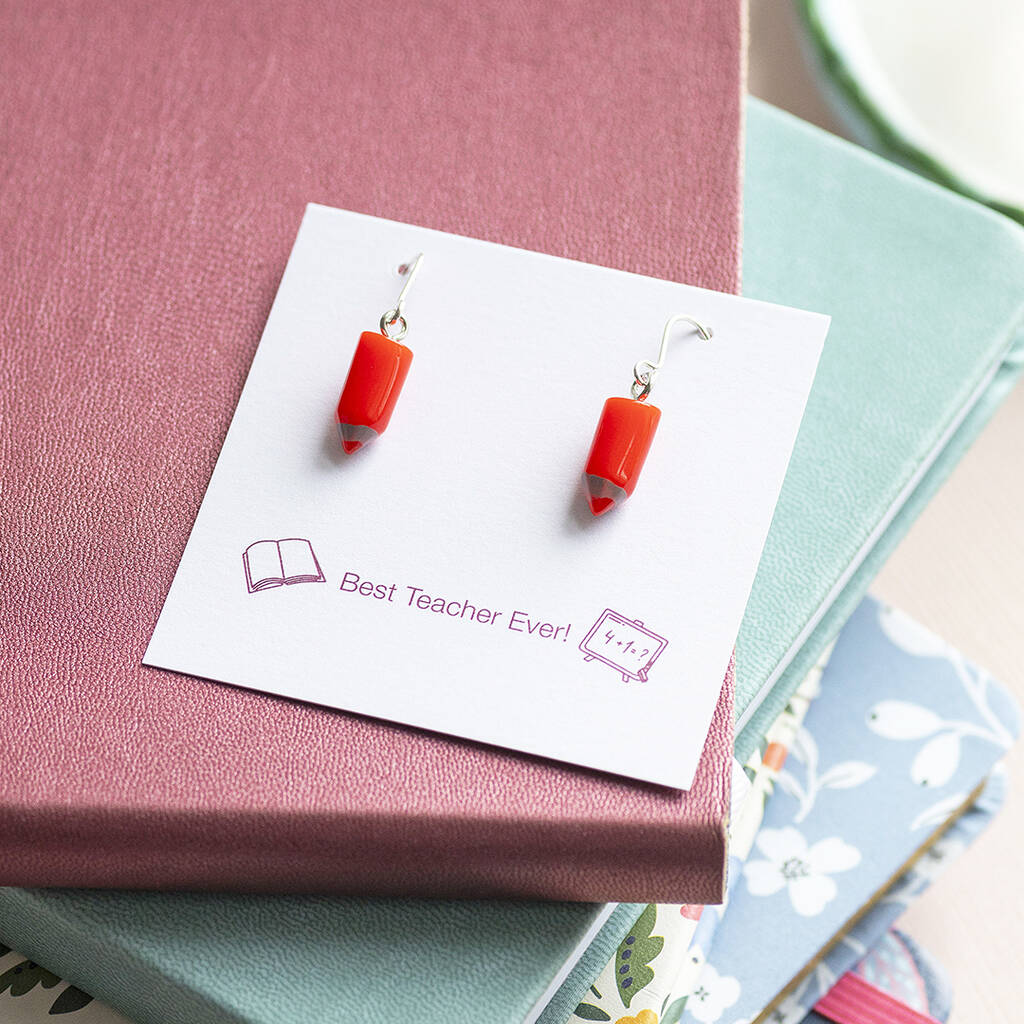 Red pencil drop earrings on a keepsake display card, colourful novelty jewellery with a playful finish.