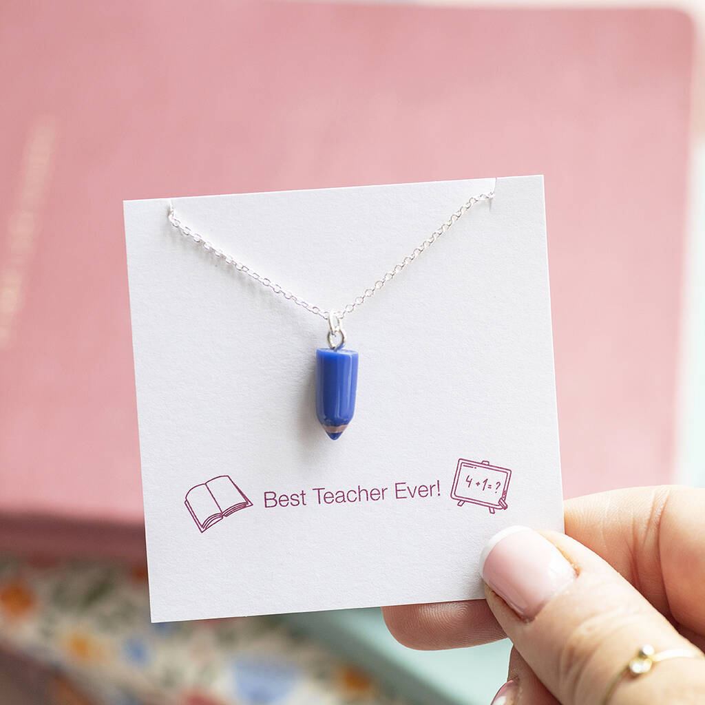 Blue pencil charm necklace on a silver chain with keepsake display card, colourful playful jewellery.