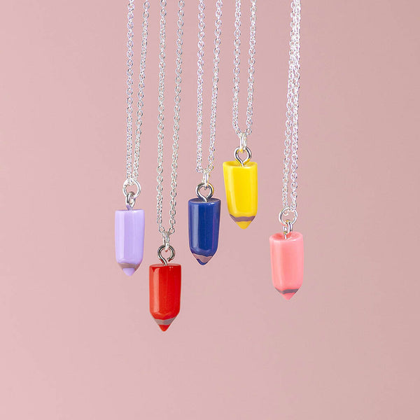 Five pencil charm necklaces suspended on silver chains. Colours from left to right, Lilac, Red, Blue, Yellow and Pink.