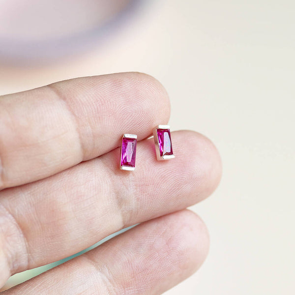 Silver dainty ruby baguette birthstone stud earrings.