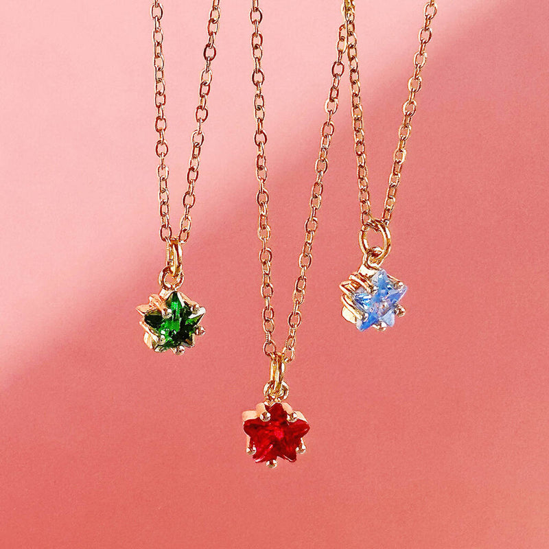 Image shows emerald, ruby and aquamarine dainty birthstone star necklaces