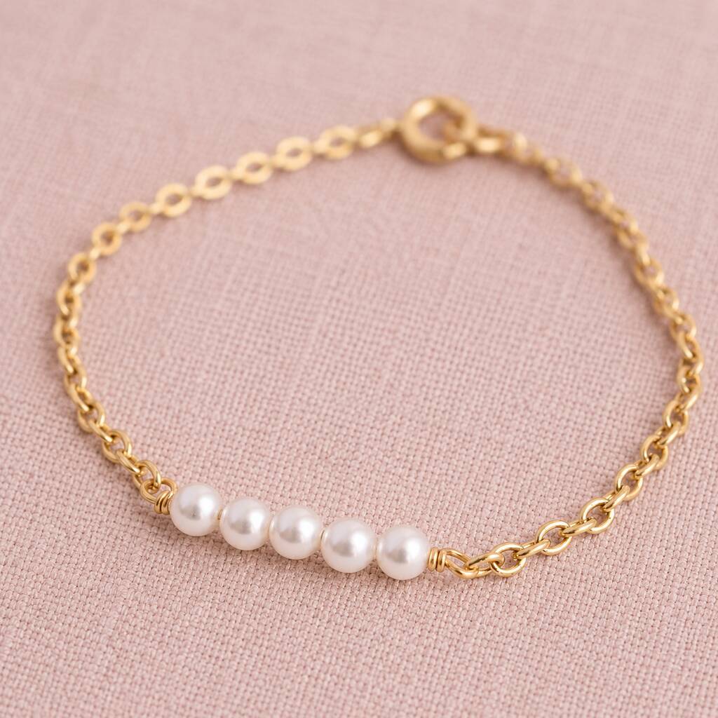 Gold plated Swarovski pearl bracelet with four luminous pearls, minimalist jewellery for stacking with favourites.