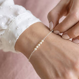 Sterling silver Swarovski pearl bracelet with four pearls, delicate jewellery for layering with classic pieces.