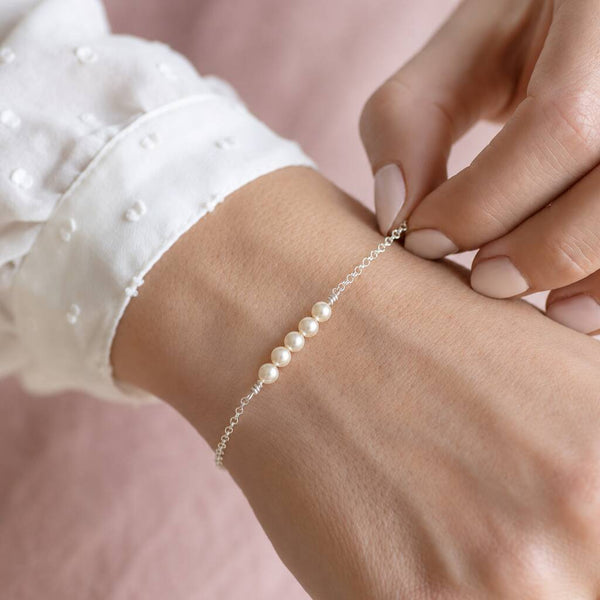 Sterling silver Swarovski pearl bracelet with four pearls, delicate jewellery for layering with classic pieces.