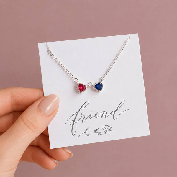 Double heart birthstone necklace displayed on sentiment card with colourful crystal heart charms