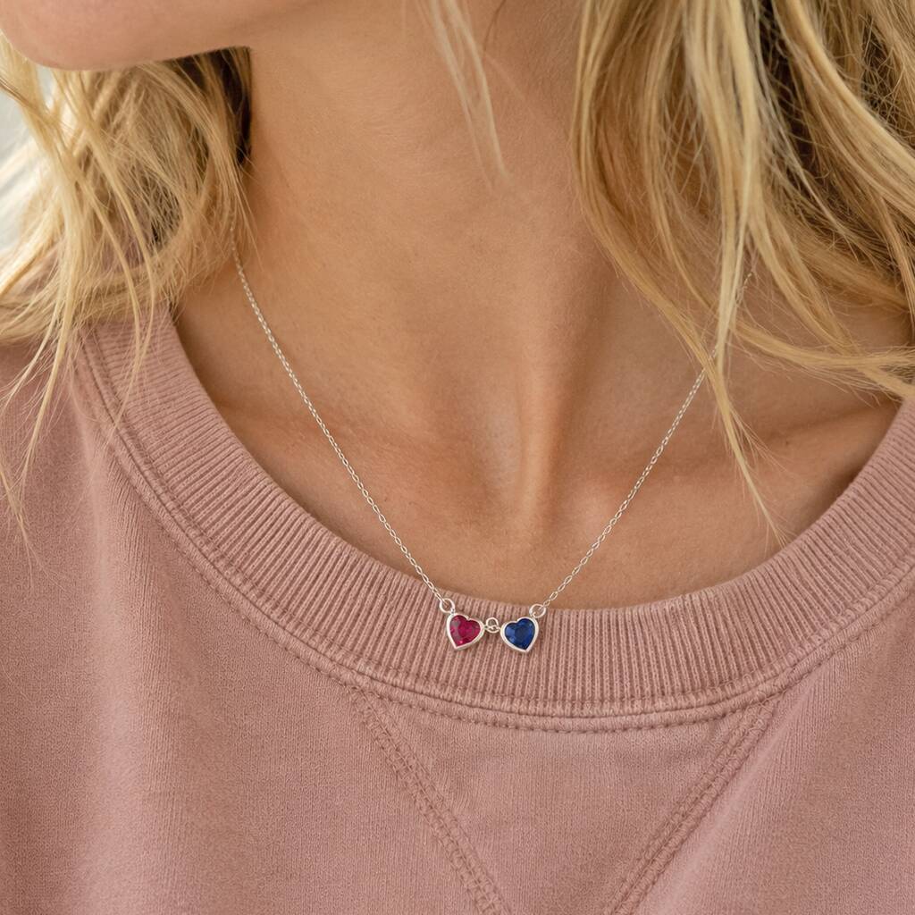 Silver double heart birthstone necklace with pink and blue crystal charms, perfect for layering jewellery