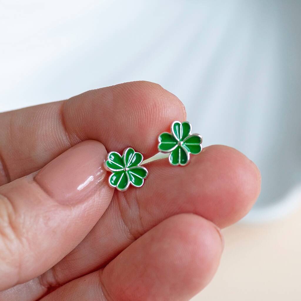 Silver four leaf clover stud earrings.