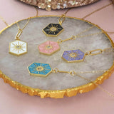 Image shows Enamel Hexagon Star Necklace in five available colours from top: black, white, pink, turquoise and purple.