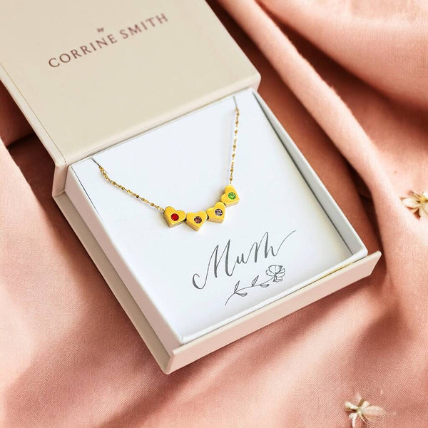 Gold Family Birthstone Sliding Hearts Necklace with colourful crystal hearts, styled in JOY gift packaging