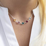 Model wears a silver Family Birthstone Link Necklace with five Swarovski Birthstone Crystals; yellow topaz, purple amethyst, green emerald, red garnet and aquamarine to represent the birth months November, February, May, January and March.