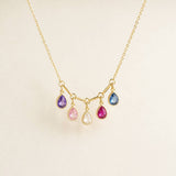 Gold plated birthstone necklace with five colourful teardrop crystal charms, designed to add colour and movement to any look