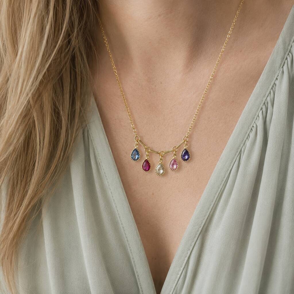 Gold plated necklace with colourful teardrop birthstone charms, styled as a delicate statement layering piece