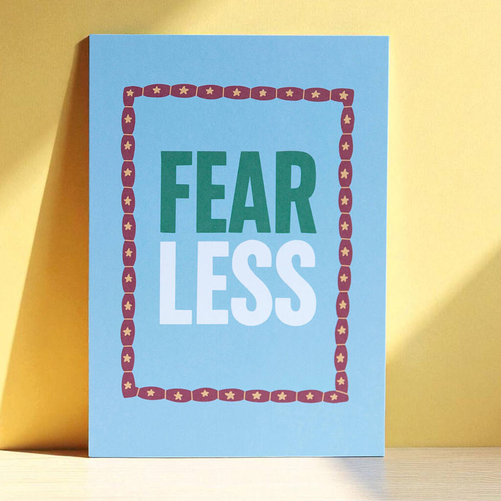 Inspirational wall art print with Fear Less quote in bold lettering on blue background