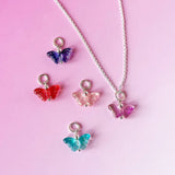 Image shows silver plated necklace with five coloured glass butterfly charms