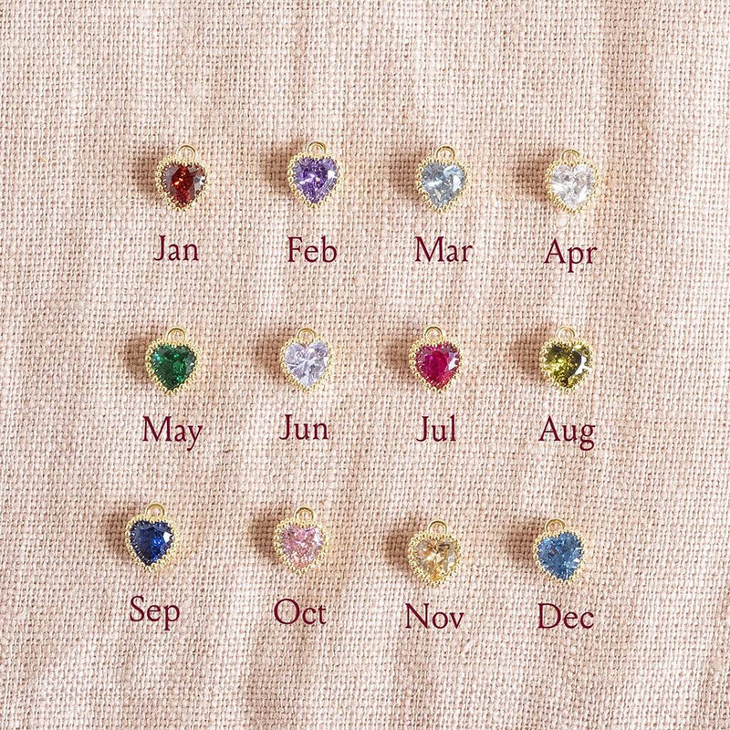 Image shows Crystal Birthstone Hearts Chart, from top left; Garnet January, Amethyst February, Aquamarine March, Crystal April, Emerald May, Light Amethyst June, Ruby July, Peridot August, Sapphire September, Rose October, Yellow Topaz November, Blue Zircon December.
