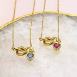 Image shows two Friendship Knot Necklace with Heart Birthstones on a white backdrop.