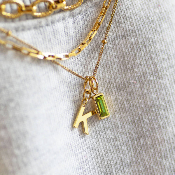 Personalised gold letter necklace with baguette cut birthstone