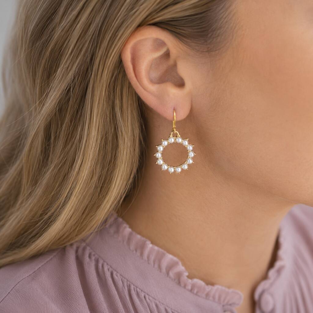 Gold plated hoop earrings with pearl sunburst detailing, adding texture and interest to everyday styling