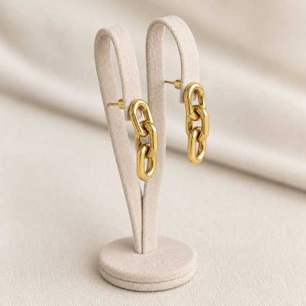 Statement chain drop earrings in polished gold plating, highlighting their elongated link design and sleek finish
