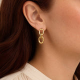 Bold gold plated drop earrings with polished chain links and a sculptural silhouette, perfect for elevated styling
