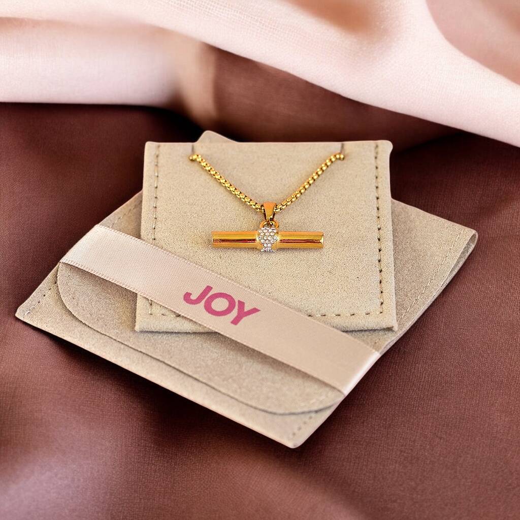 Crystal T bar pendant necklace displayed in JOY packaging, featuring a sleek gold plated design with sparkling detail