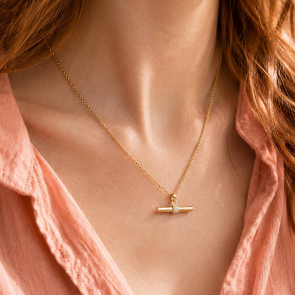 Delicate gold plated necklace with a crystal T bar pendant, perfect for minimalist layering and everyday styling
