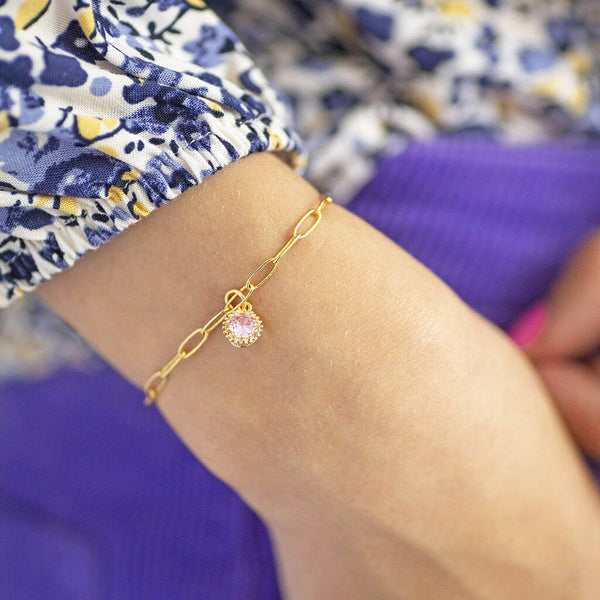 Model wears Gold Plated Ornate Round Birthstone Bracelet with an October rose birthstone