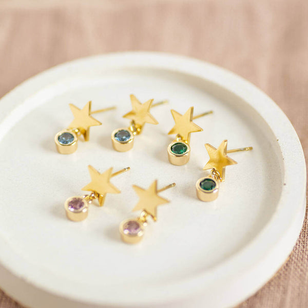 Image shows three pairs of Gold Plated Star Birthstone Earrings from left to right, March aquamarine, May emerald and October Rose birthstones,