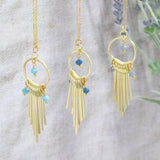 Image shows three Gold Plated Tapered Statement Necklaces in all available bead colours from left: blue, indigo and grey.