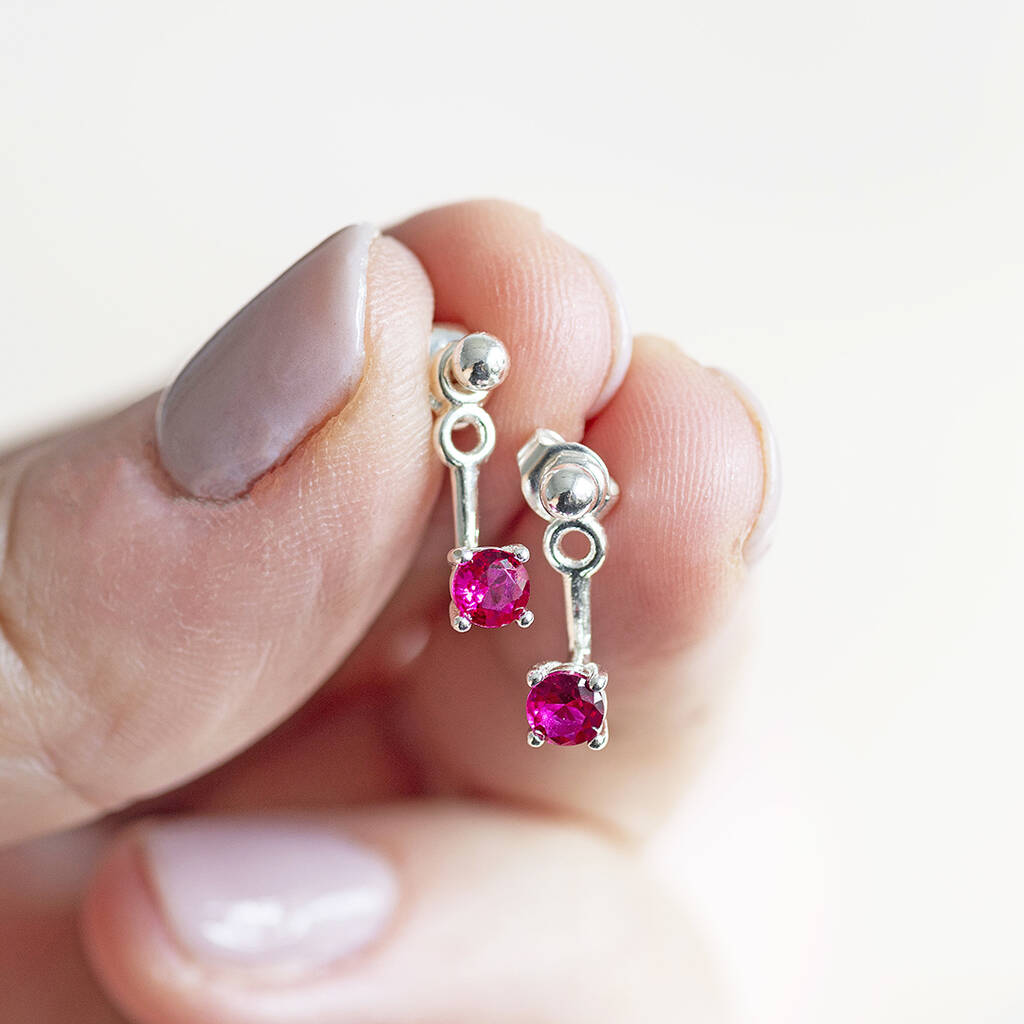 Pair of Illusion Birthstone Stud Earrings with a classic round-cut gemstone set in a minimalist prong setting, designed to showcase the birthstone's vibrant colour and clarity.