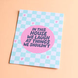 Funny wall art print with In This House We Laugh At Things We Shouldn’t quote in pink and blue