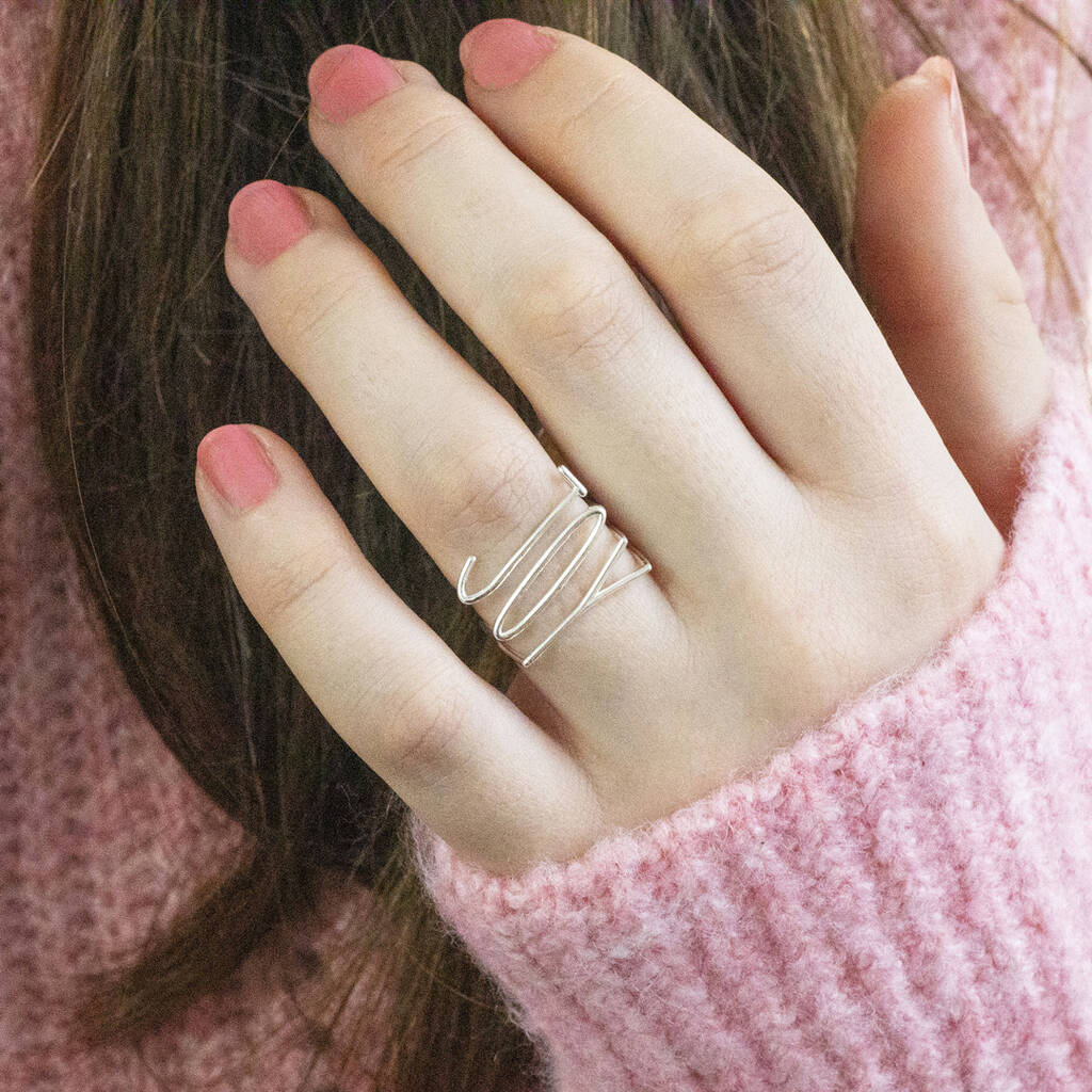 Model wears silver plated JOY Stacking Rings Set