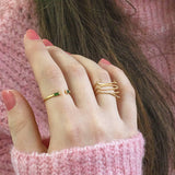 Model wears gold plated JOY Stacking Rings Set.
