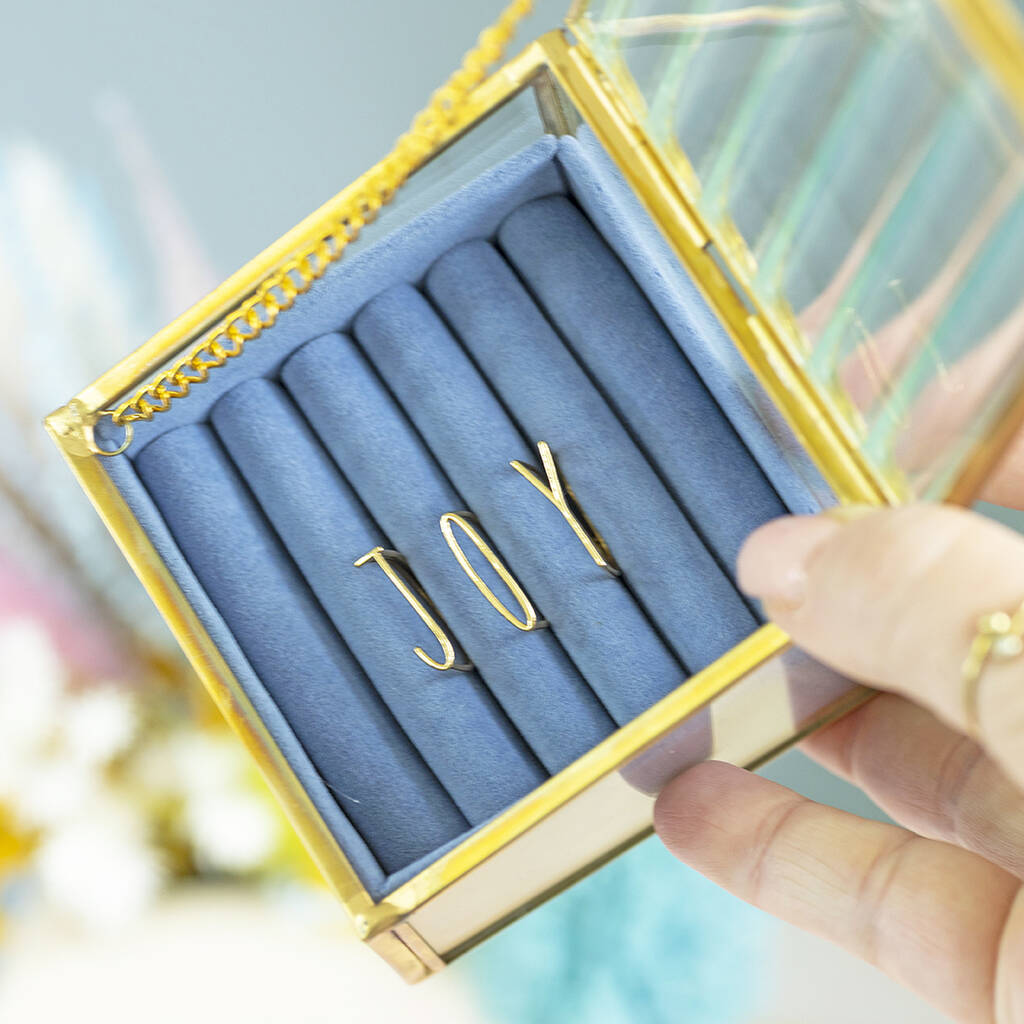 Image shows the gold plated JOY Stacking Rings Set in a blue jewellery box.