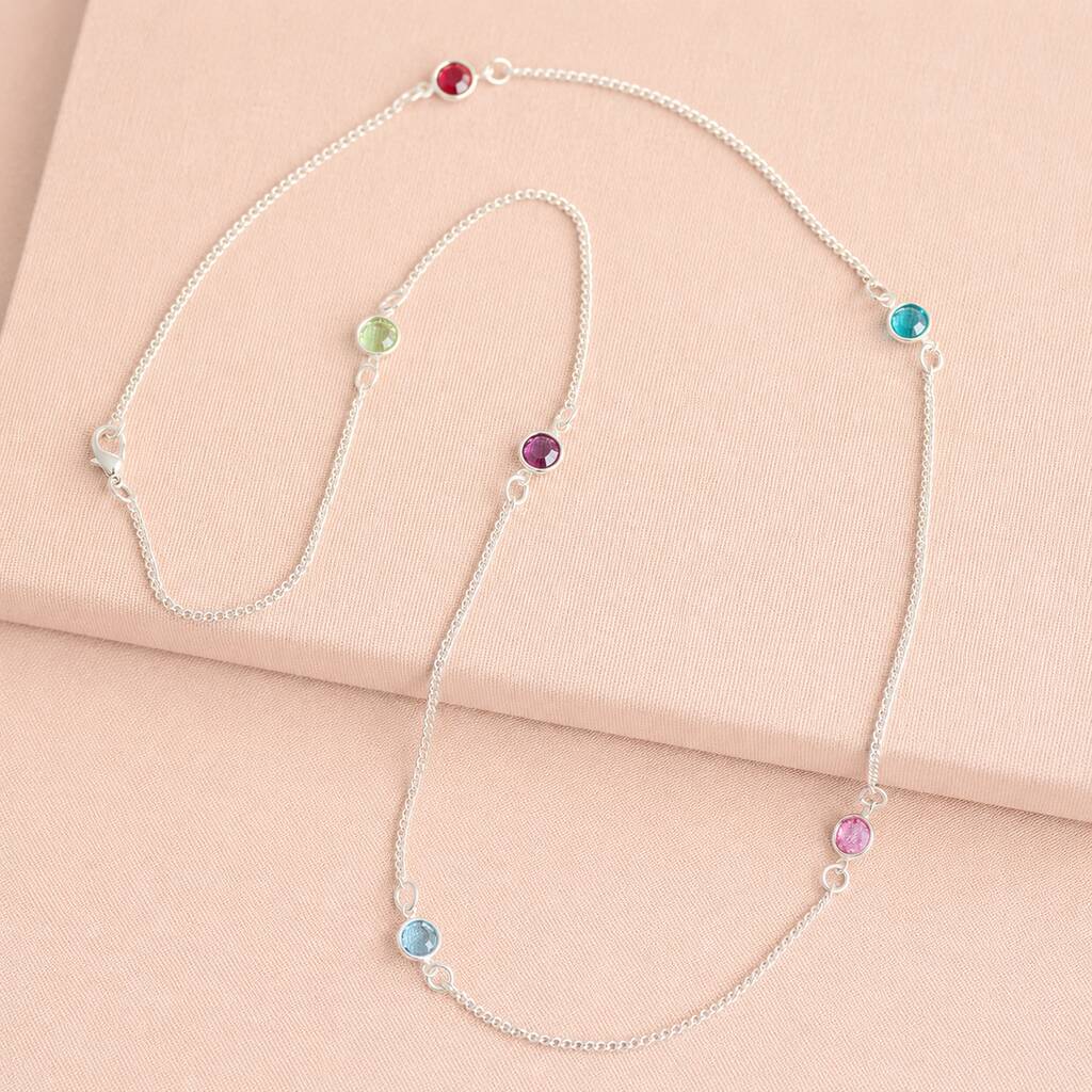 Silver long birthstone necklace with pink, purple and blue crystal accents, colourful layered jewellery with a modern finish.