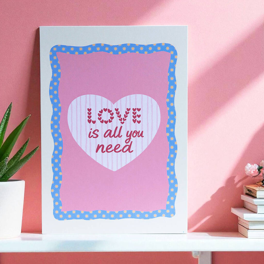 Love Is All You Need A5 wall print with pink heart design and floral blue border