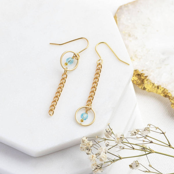 Image shows Mismatched Birthstone Circle Chain Drop Earrings with the March Aquamarine birthstone on a white backdrop.