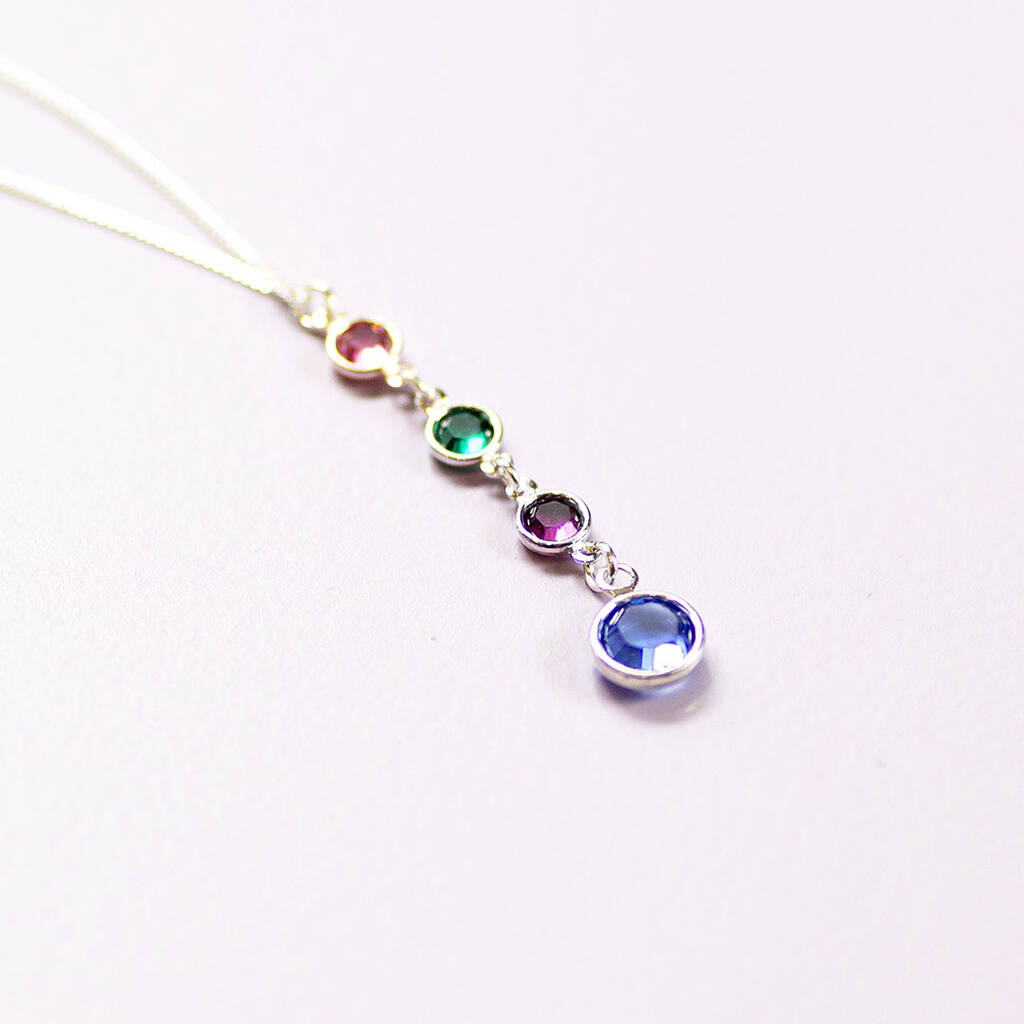 Silver birthstone drop necklace featuring four colourful crystal charms in a cascading pendant design