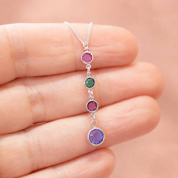 Silver birthstone pendant necklace with four colourful crystal drops, a meaningful layered jewellery style piece