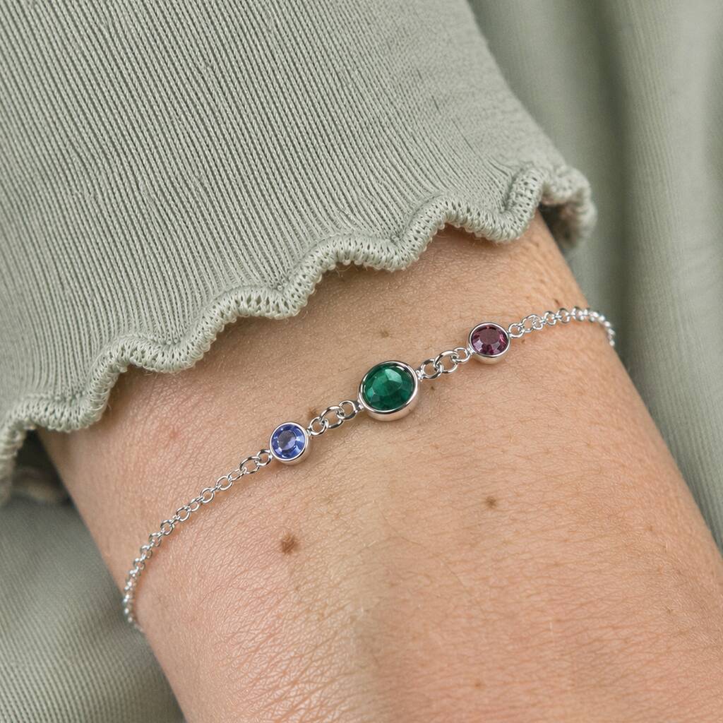 Silver plated birthstone bracelet with emerald, blue and purple crystal charms, colourful jewellery for effortless layering.