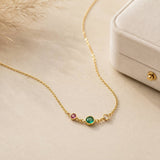 Gold birthstone link necklace with three colourful bezel-set crystals, ideal for everyday styling or layering
