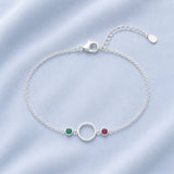 Silver plated circle bracelet featuring two bezel set birthstones for colourful everyday jewellery styling