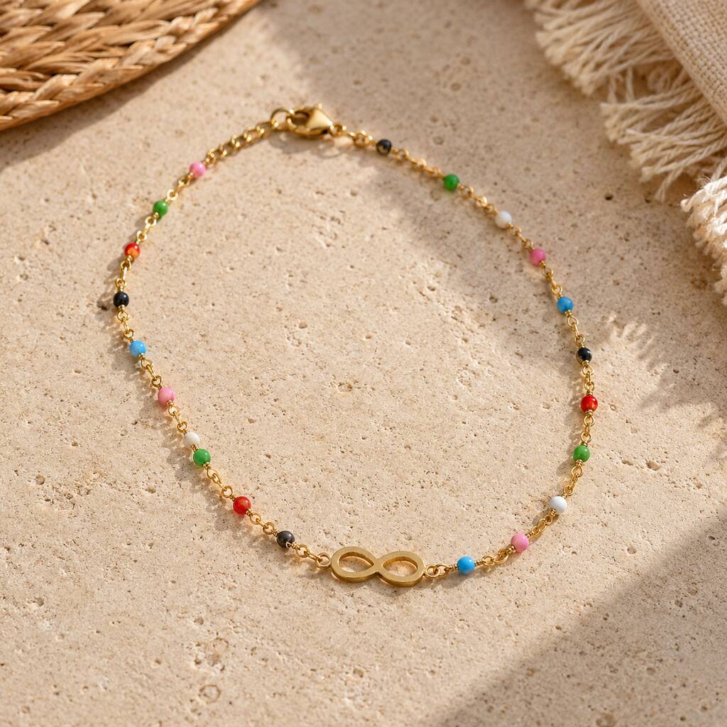 Colourful beaded infinity anklet with a gold plated infinity symbol, perfect for everyday summer styling