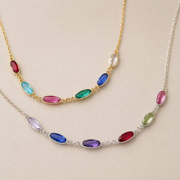 Silver and gold plated birthstone link necklaces with vibrant crystal details, perfect for colourful layered styling.