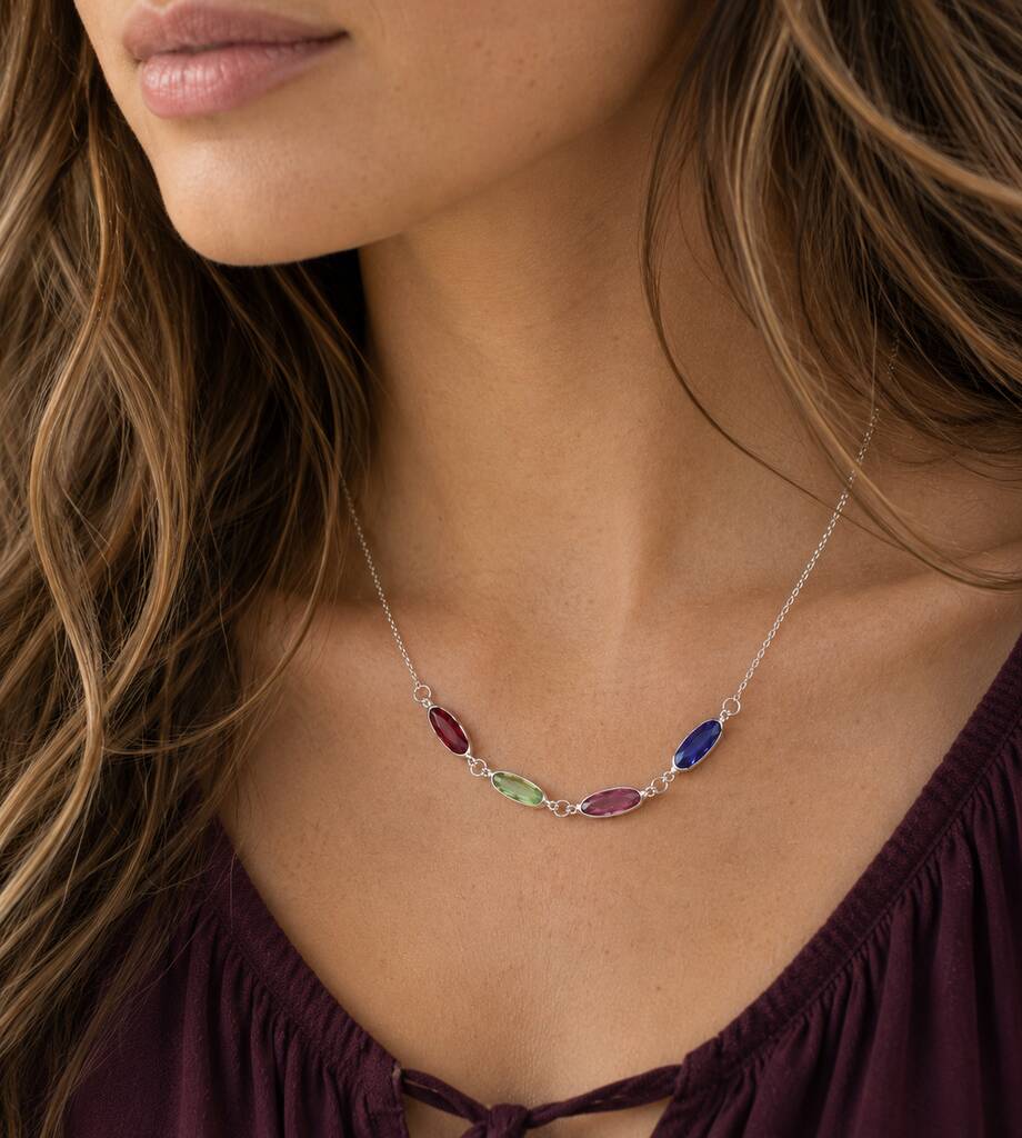 Delicate silver plated necklace with colourful oval birthstone links, styled as a vibrant everyday layering piece.